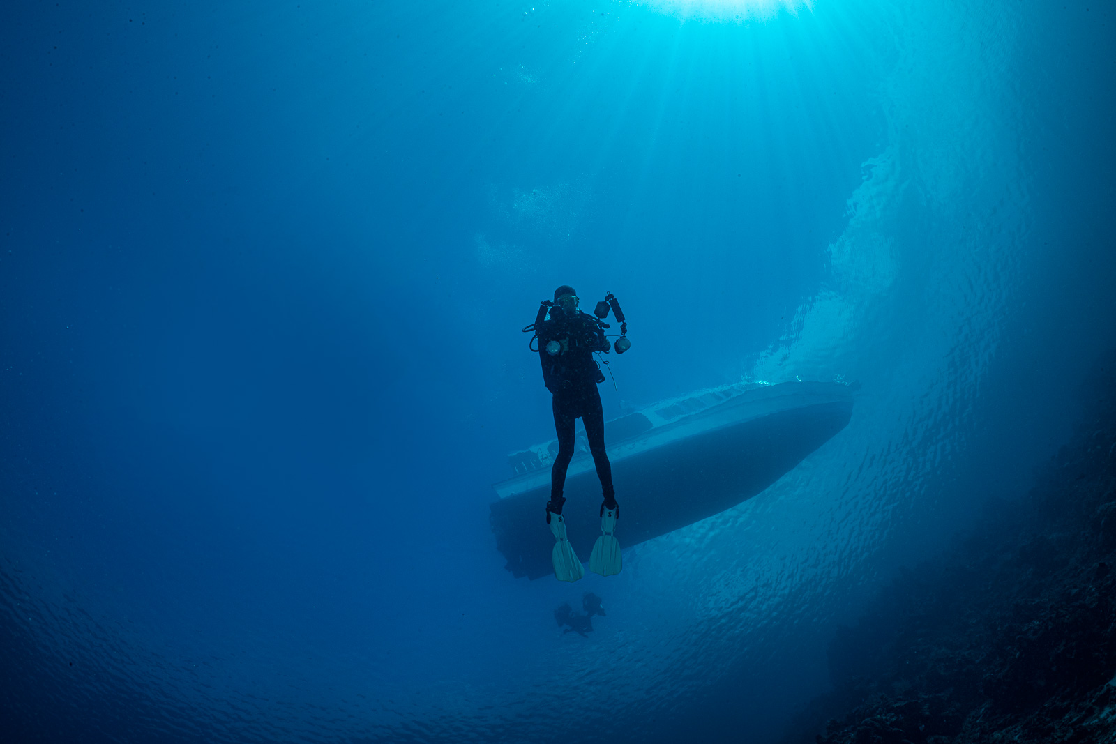 A photographer under a boat, Bunaken