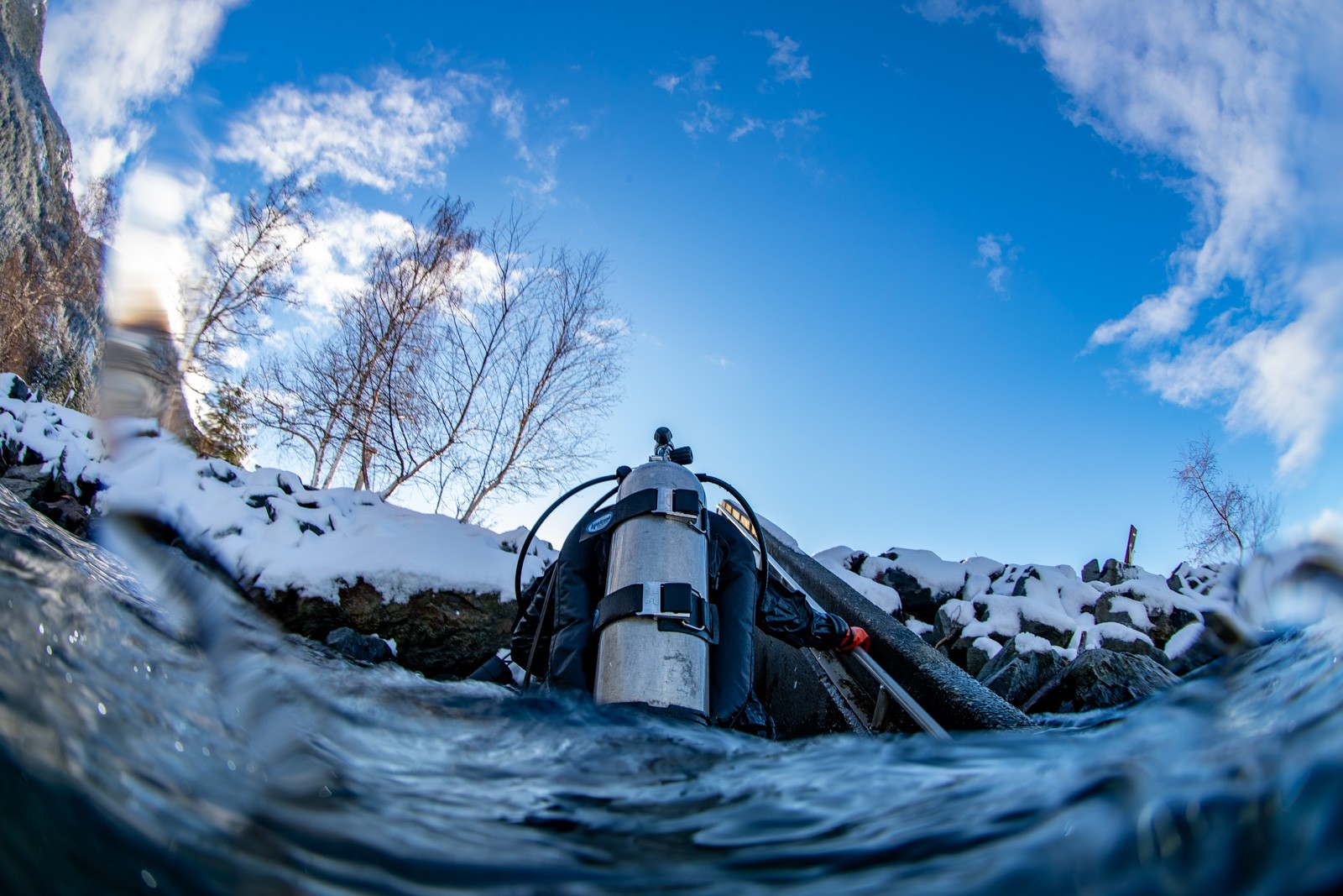 Over-under at a snowy shore, tank at the waterline, Howe Sound